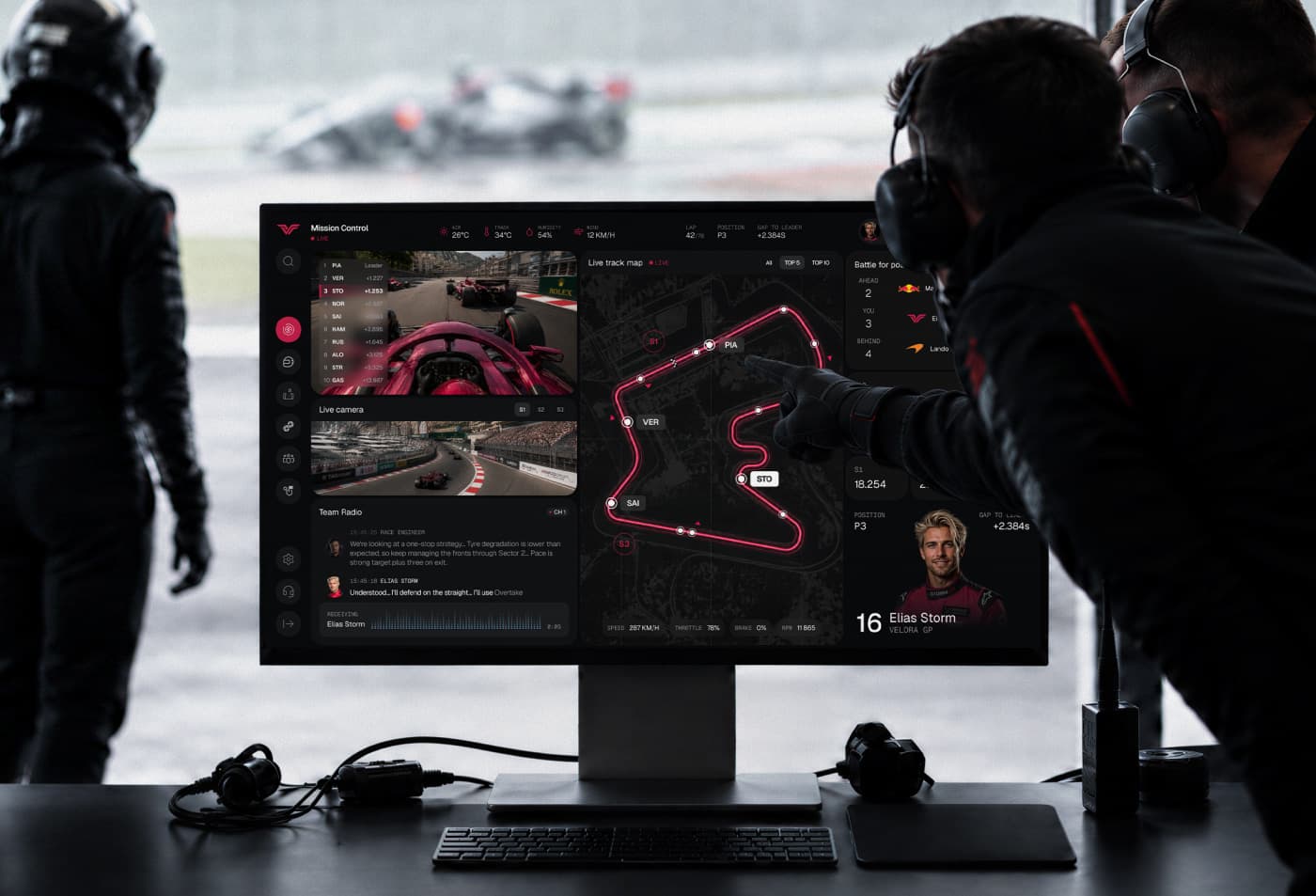 Dark Formula 1 race-operations dashboard showing live camera panels, a highlighted circuit map, team messages, and driver data.